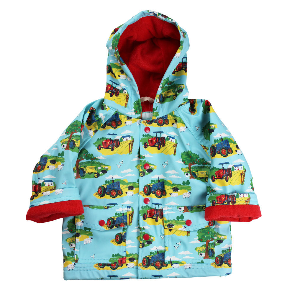Countryside Print Raincoat flat lay on white background showing tractor print and red fleece lining